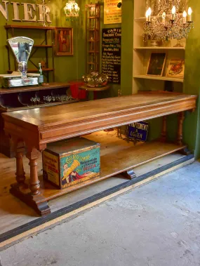 Antique French oak drapery table from a silk boutique