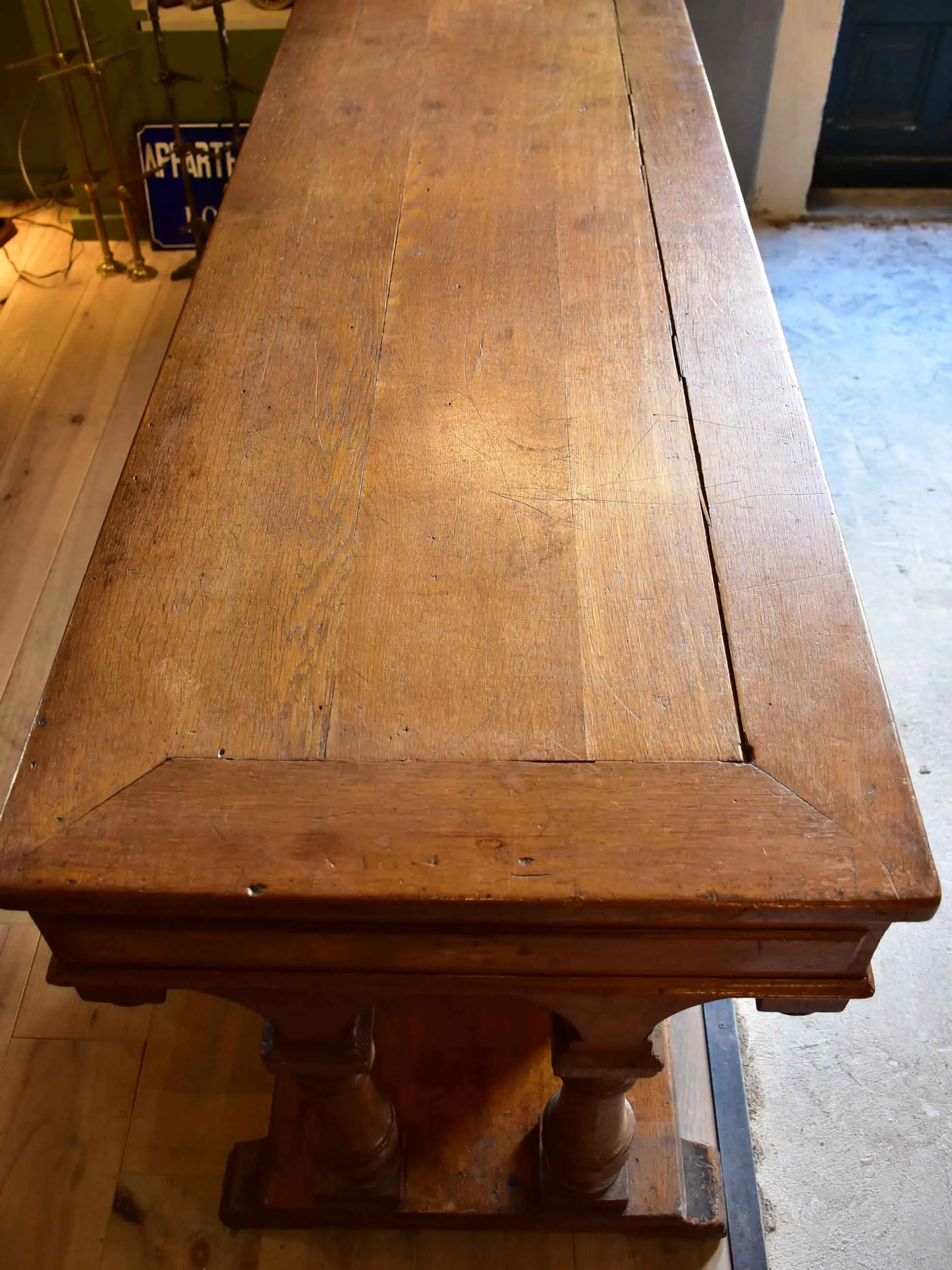 Antique French oak drapery table from a silk boutique